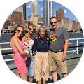 Family posing by city waterfront