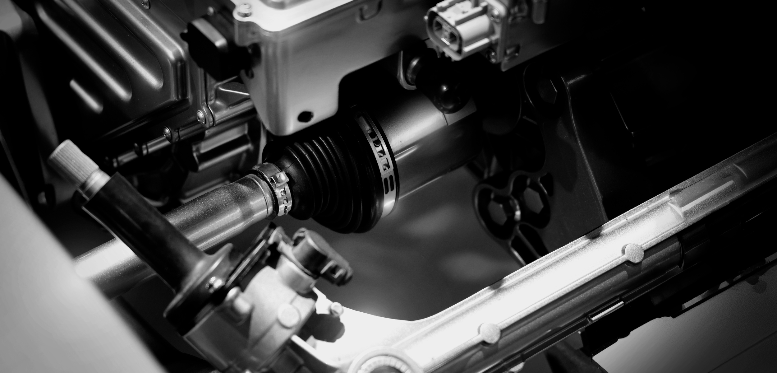 Car suspensions. Close up of a car suspension parts system such as CV joint Rubber boot and Control arms bushing Steering rack axles Shock absorber suspension Brake. Repair and spare parts for cars.