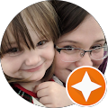 Smiling child and woman with glasses