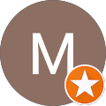 M initial with orange star badge